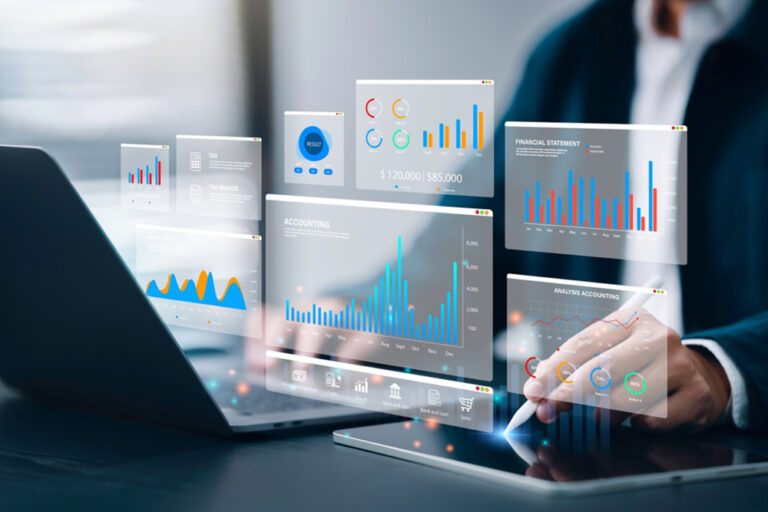 Two,Colleagues,Analyzing,Financial,Data,Reports,On,Laptop,With,Charts