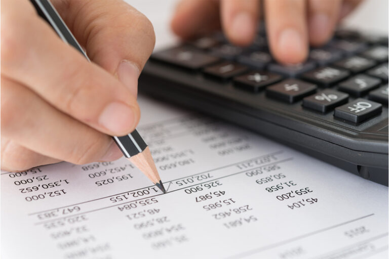 Two,Colleagues,Analyzing,Financial,Data,Reports,On,Laptop,With,Charts